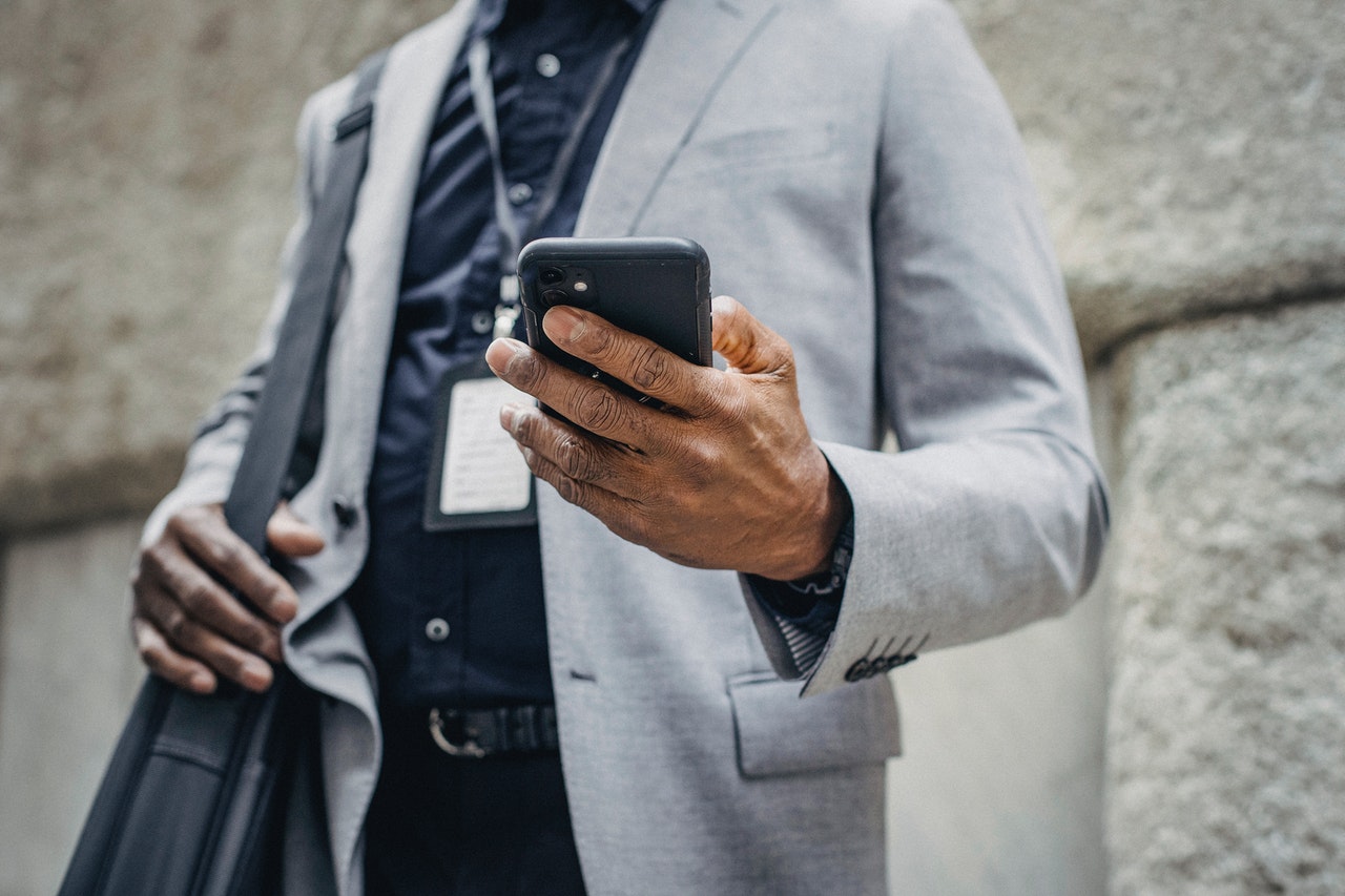 Person holding mobile phone